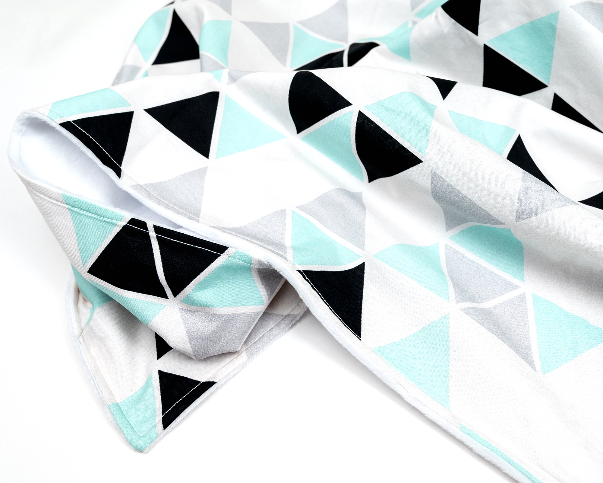 Minty Origami Baby Blanket featuring mint green, black, and light gray triangles on a white background, with soft minky backing.