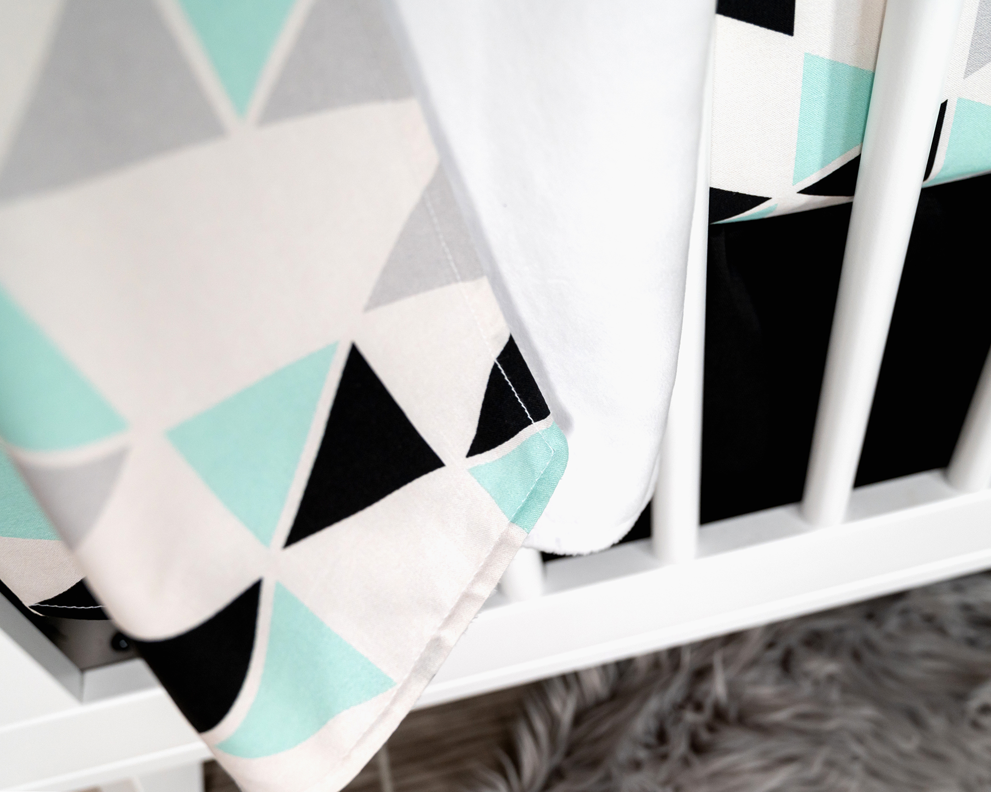 Minty Origami Baby Blanket featuring mint green, black, and light gray triangles on a white background, with soft minky backing.