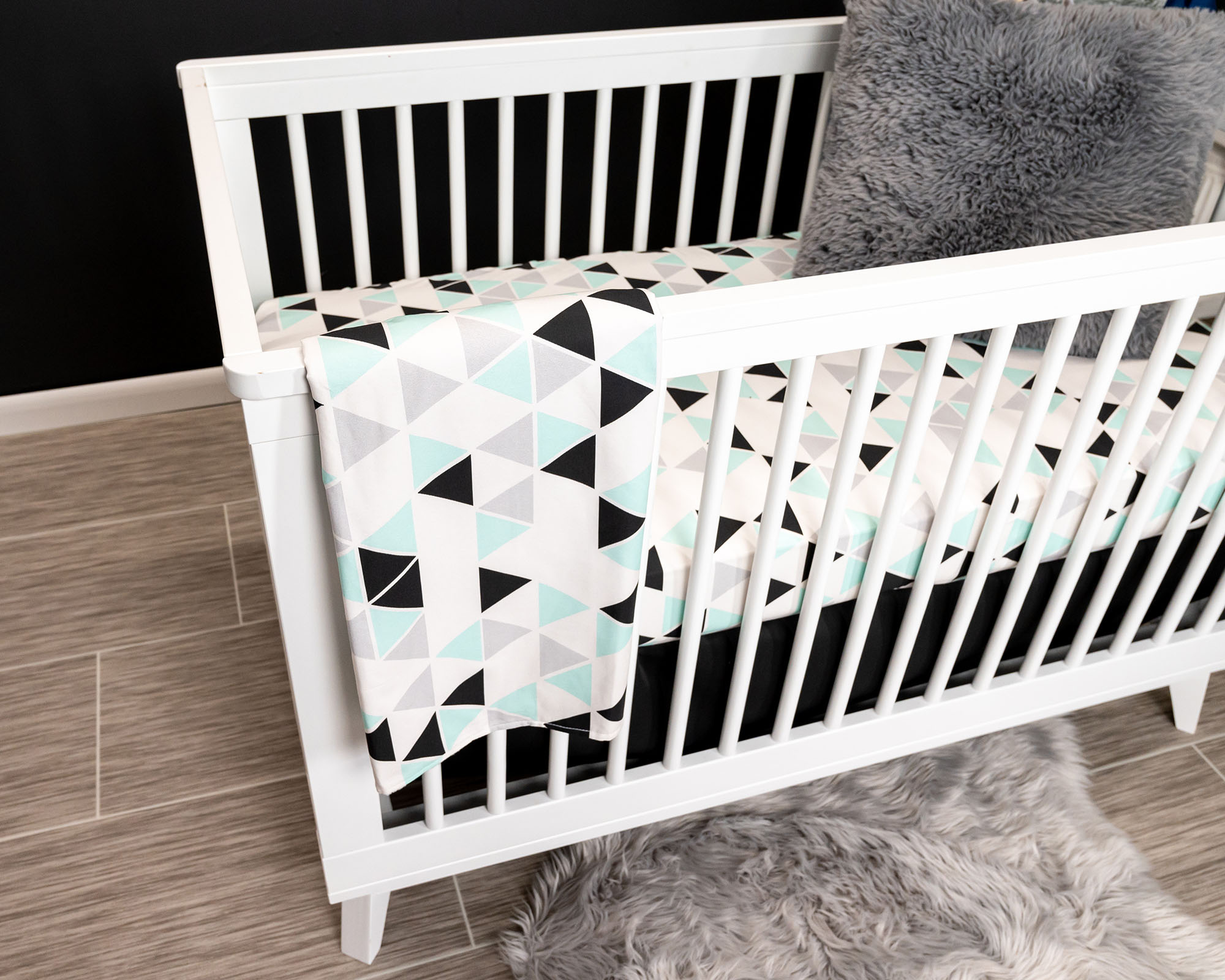 Minty Origami Baby Blanket featuring mint green, black, and light gray triangles on a white background, with soft minky backing.