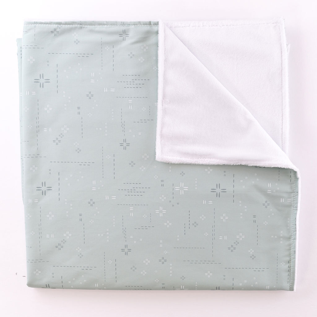 Miranda & Liam Baby Blanket featuring a soft teal geometric design with minky backing, perfect for nurseries.