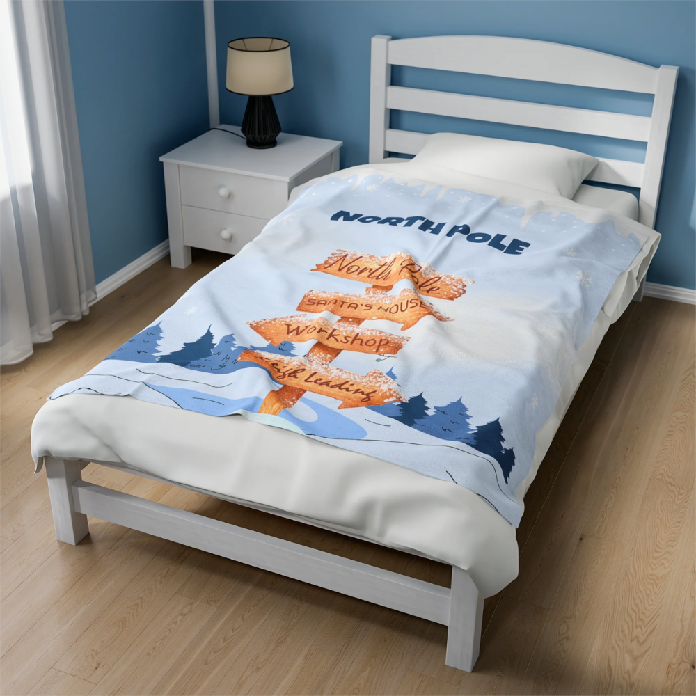 North Pole Navigation Edition Plush Blanket Throw featuring whimsical illustrations of Santa's home and directional signs, perfect for holiday decor.