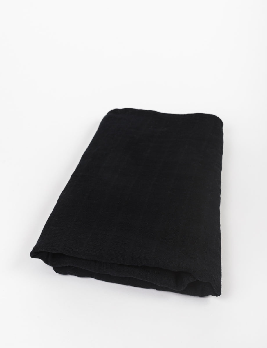 Premium Cotton Large Swaddle in Midnight Black, showcasing its soft texture and elegant design, perfect for modern nurseries.