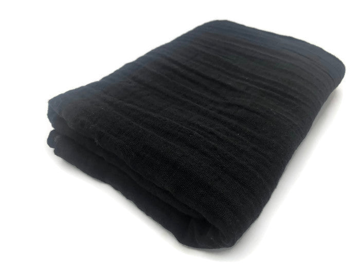 Premium Cotton Large Swaddle in Midnight Black, showcasing its soft texture and elegant design, perfect for modern nurseries.