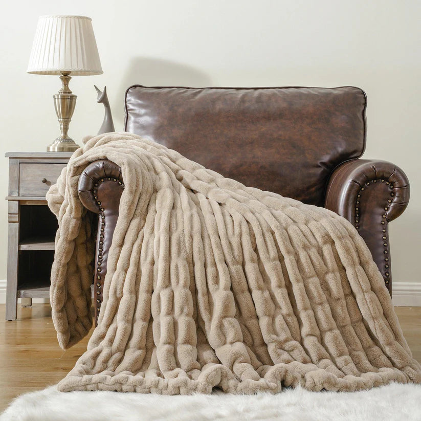 Reversible Rabbit Fur Blanket showcasing its elegant design and soft texture, perfect for home decor.