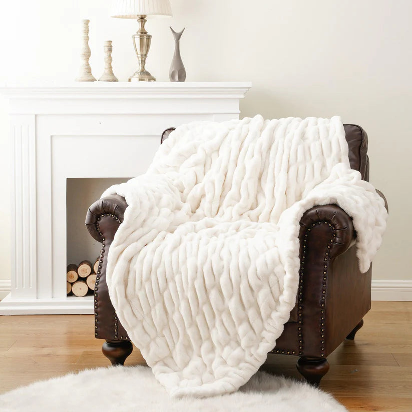 Reversible Rabbit Fur Blanket showcasing its elegant design and soft texture, perfect for home decor.