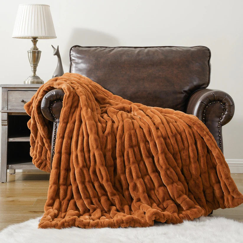 Reversible Rabbit Fur Blanket showcasing its elegant design and soft texture, perfect for home decor.