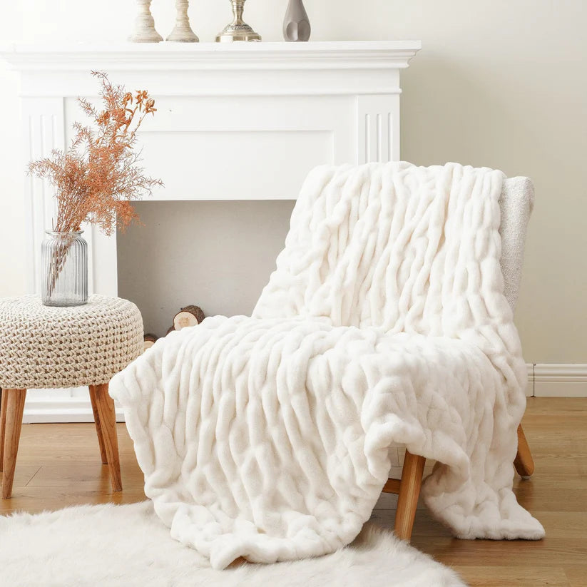 Reversible Rabbit Fur Blanket showcasing its elegant design and soft texture, perfect for home decor.
