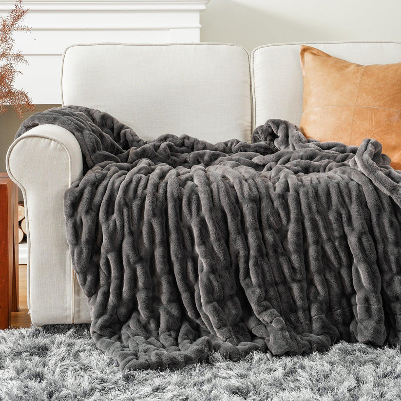 Reversible Rabbit Fur Blanket showcasing its elegant design and soft texture, perfect for home decor.