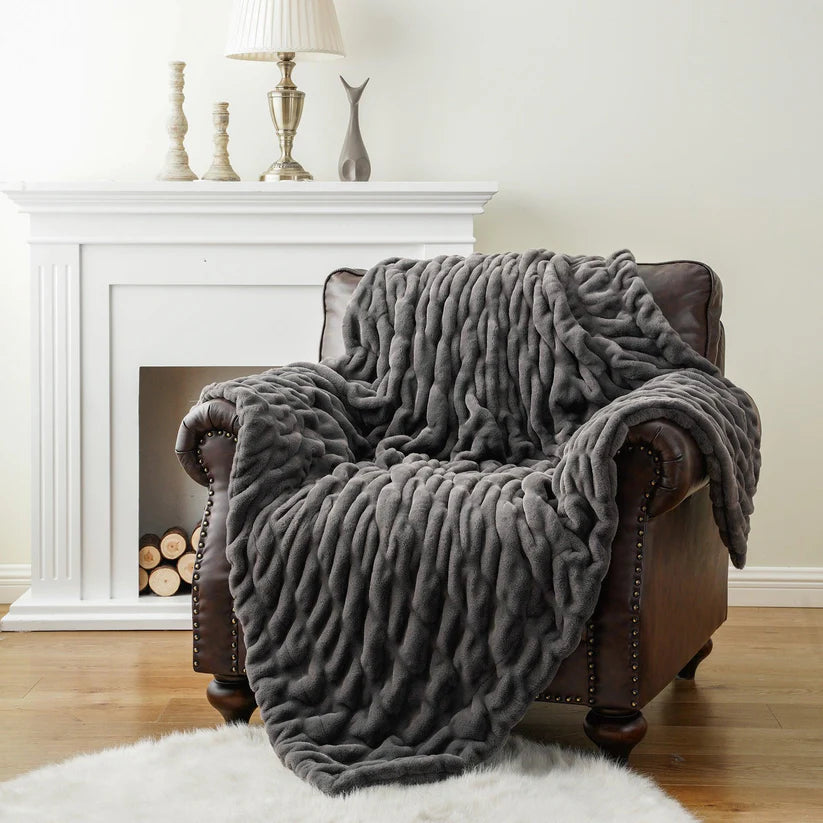 Reversible Rabbit Fur Blanket showcasing its elegant design and soft texture, perfect for home decor.