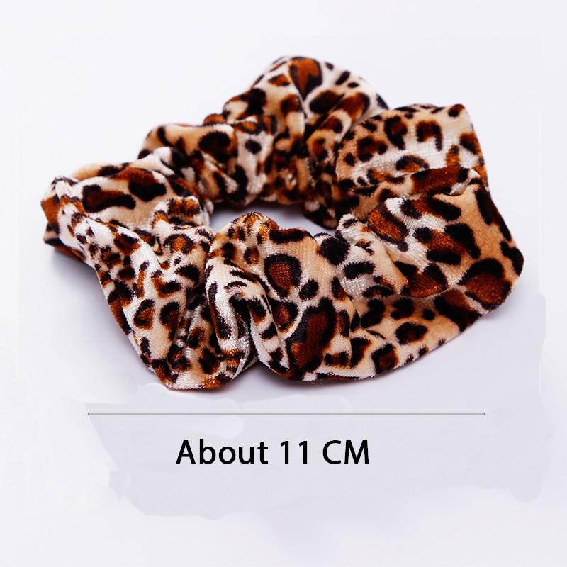 A stylish women's headwear made of soft coral fleece featuring a trendy leopard spot pattern, designed for comfort and a snug fit.