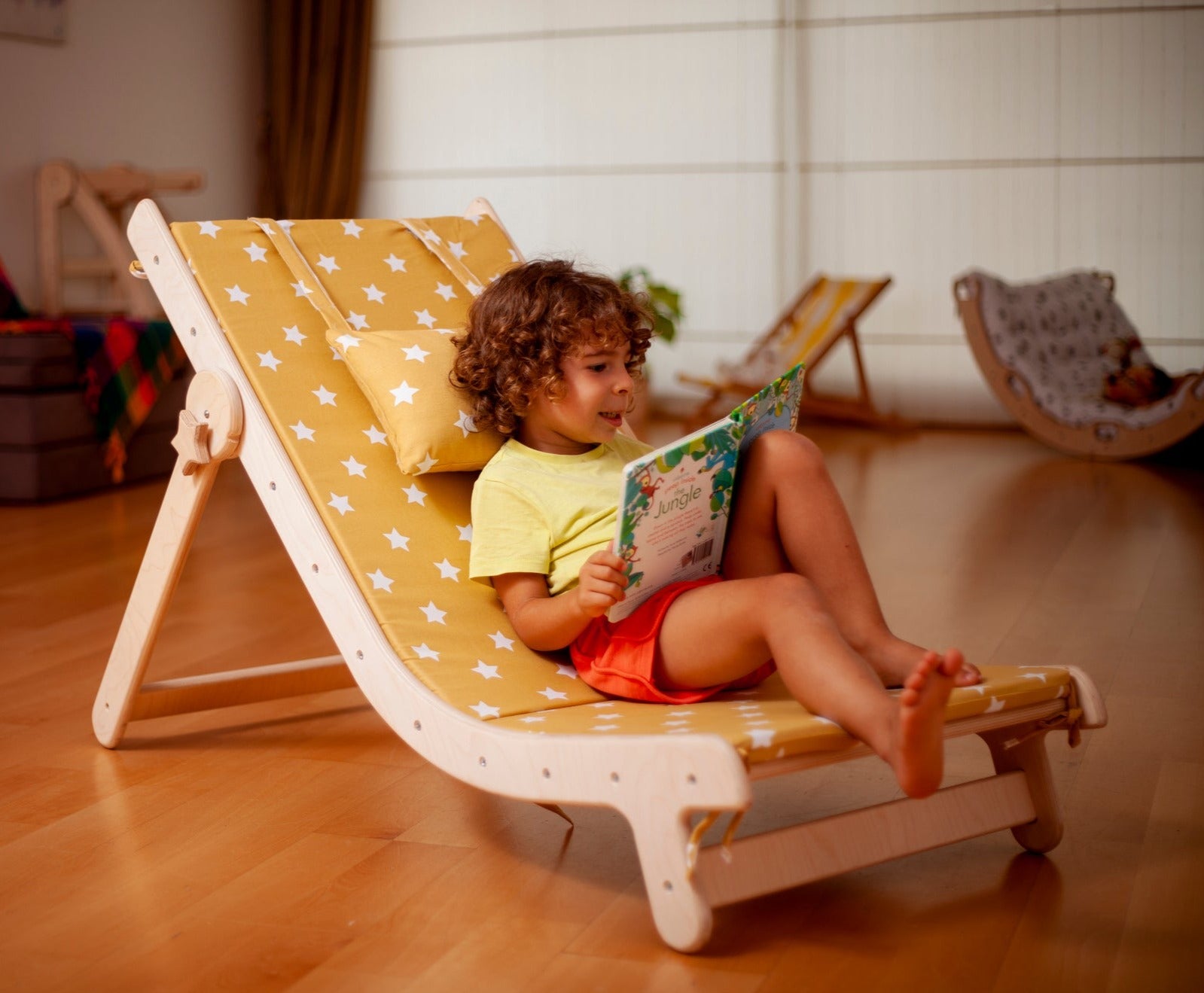 Adjustable lounge chair for kids with a comfy removable pad, designed for comfort and style.