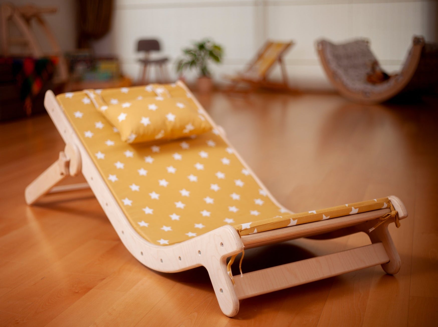 Adjustable lounge chair for kids with a comfy removable pad, designed for comfort and style.