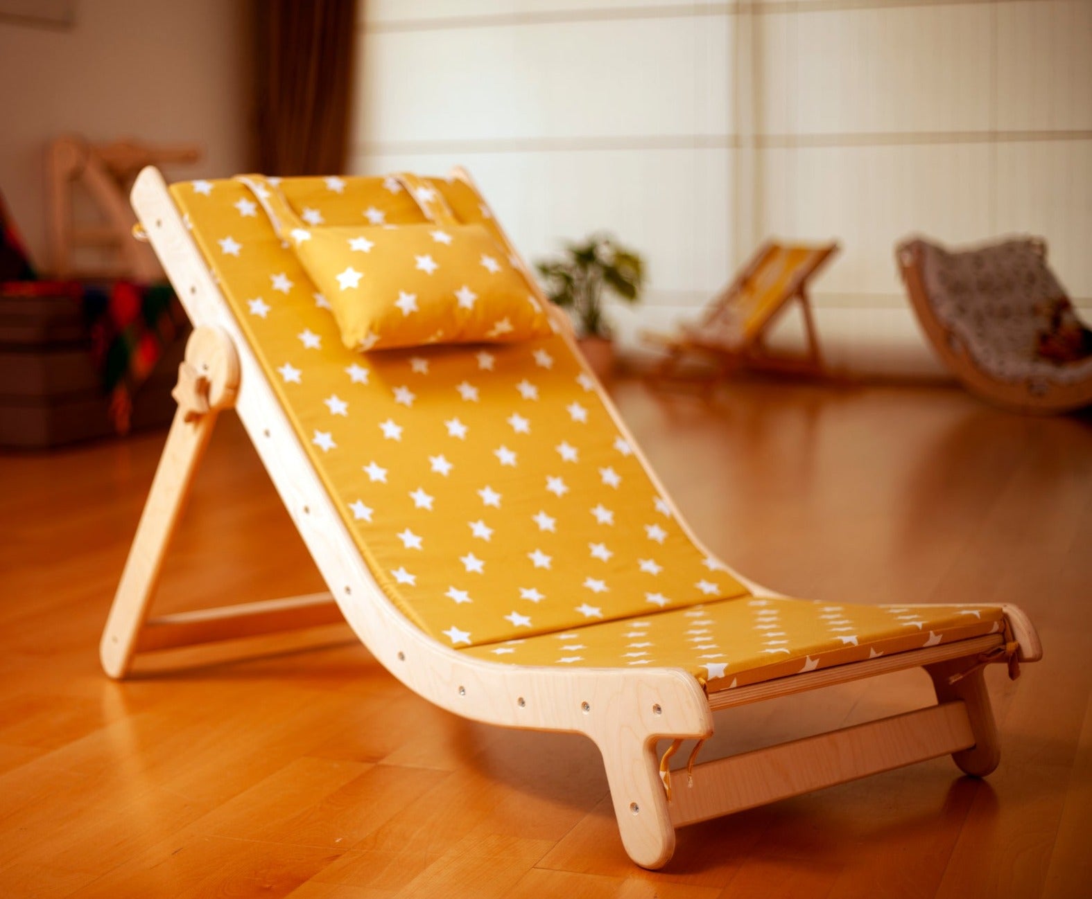 Adjustable lounge chair for kids with a comfy removable pad, designed for comfort and style.