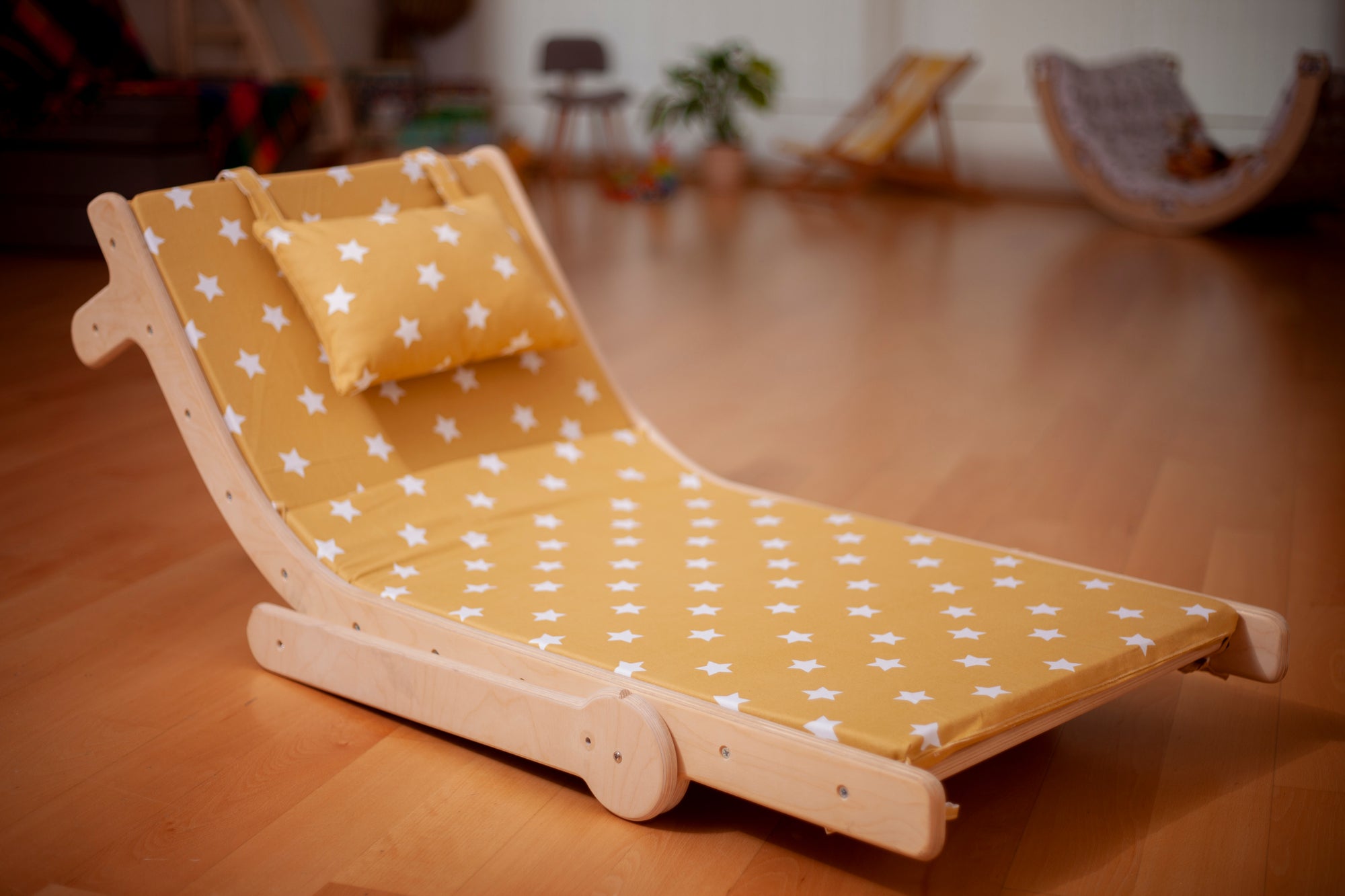 Adjustable lounge chair for kids with a comfy removable pad, designed for comfort and style.