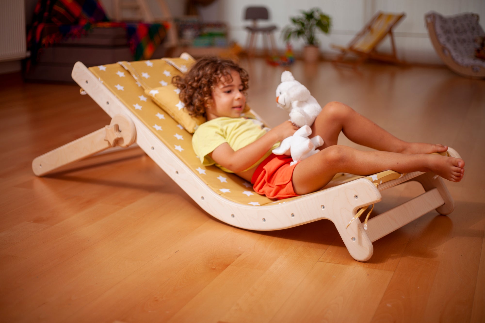 Adjustable lounge chair for kids with a comfy removable pad, designed for comfort and style.