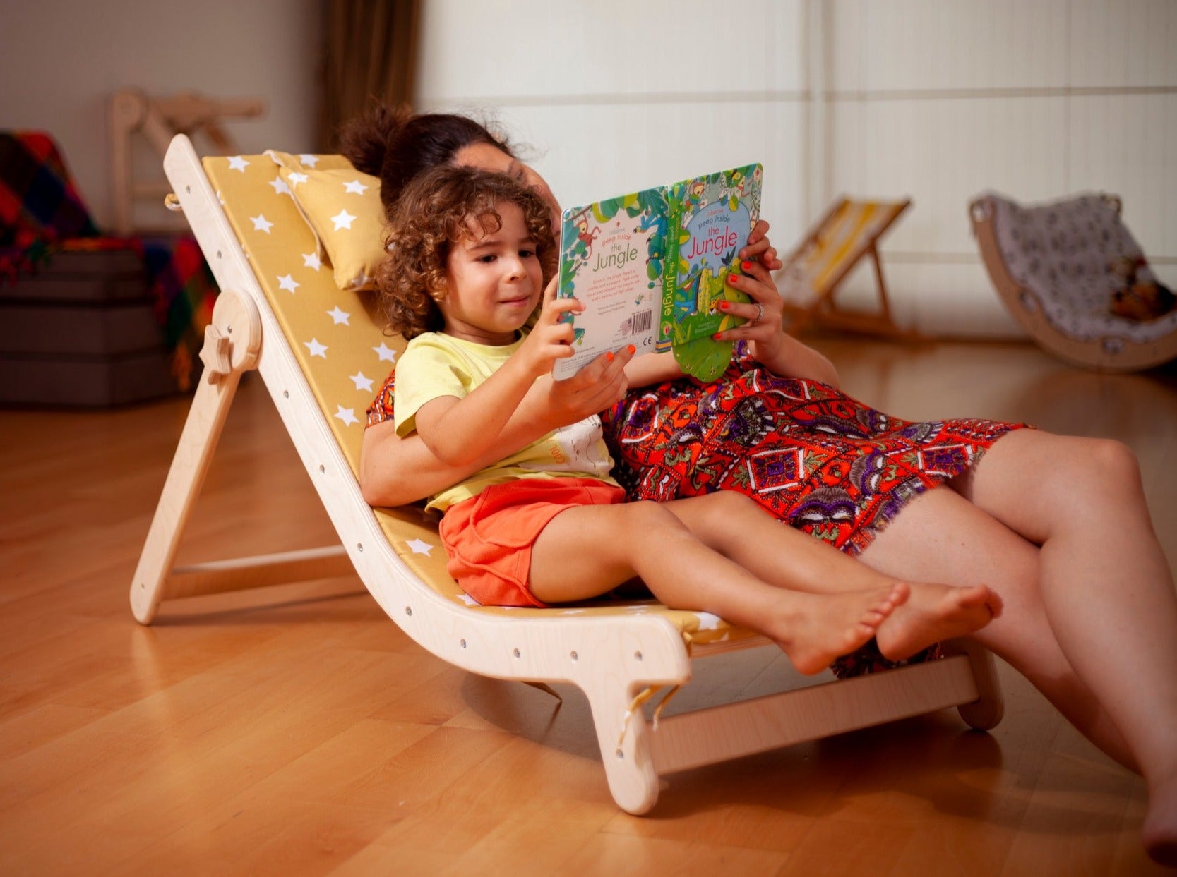 Adjustable lounge chair for kids with a comfy removable pad, designed for comfort and style.