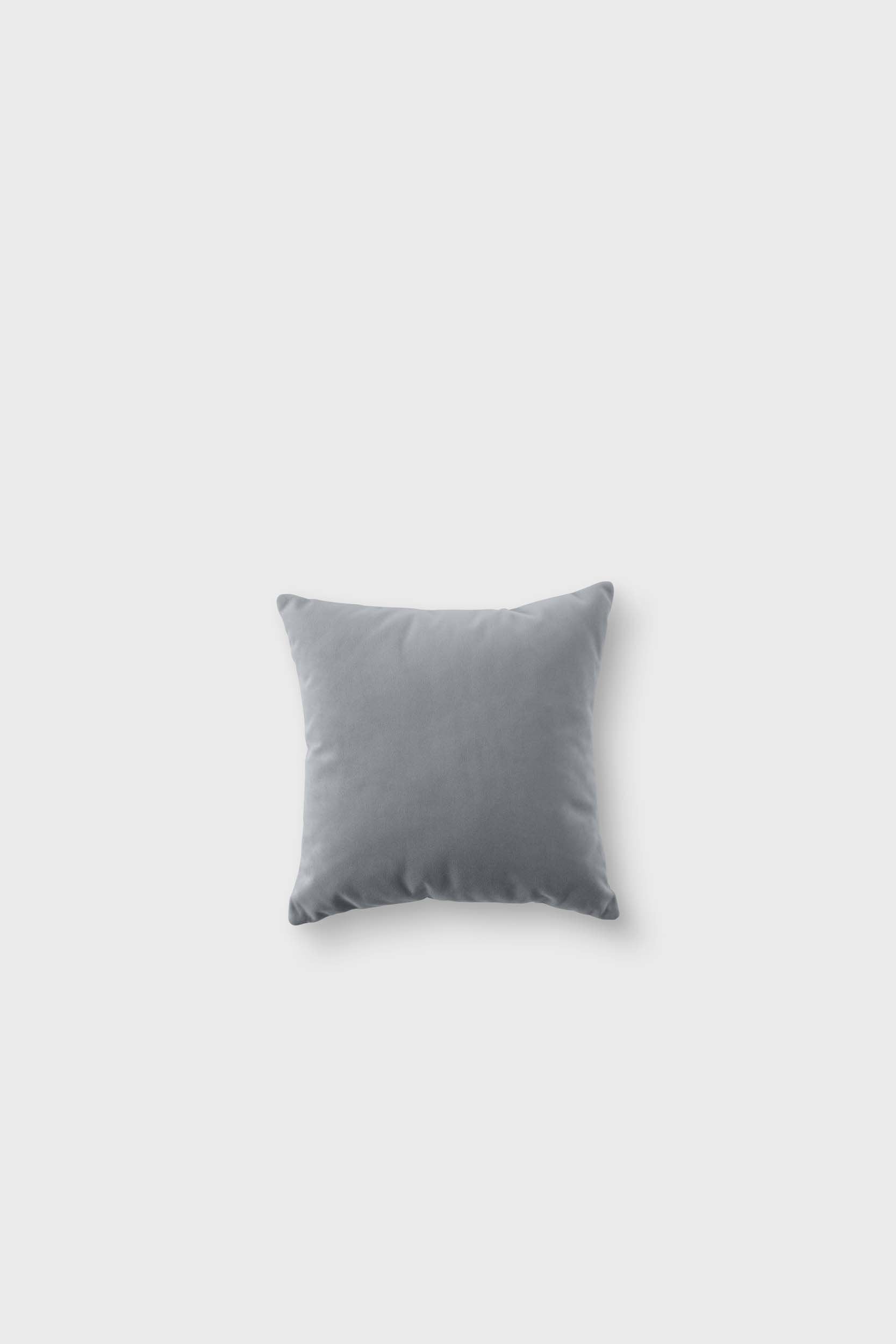 A stylish Bean modular sofa with rounded corners, soft pleated velour fabric, and elegant wooden legs, available in five colors.