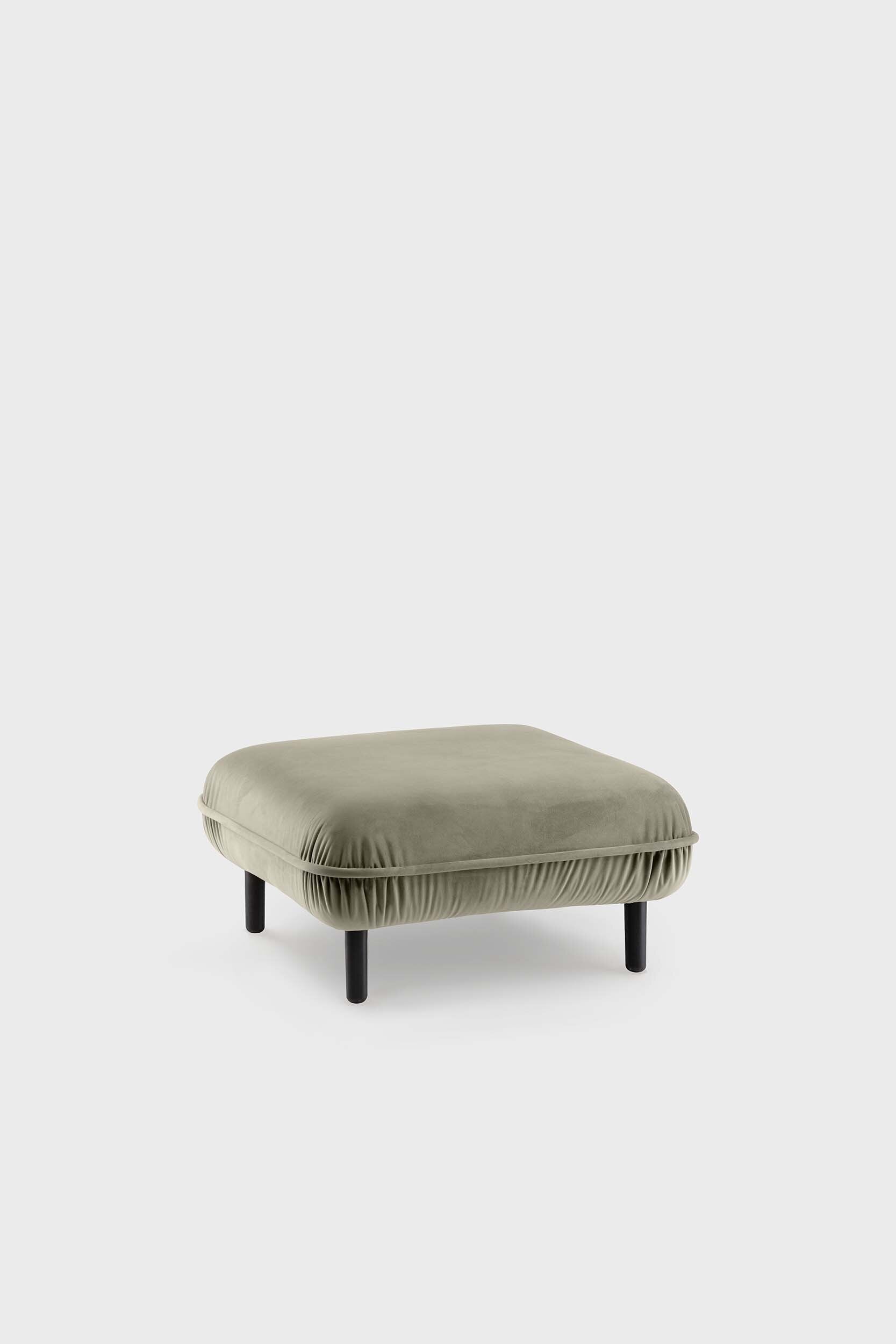 Bean Pouf featuring soft pleated velour fabric and elegant wooden legs, available in five colors.