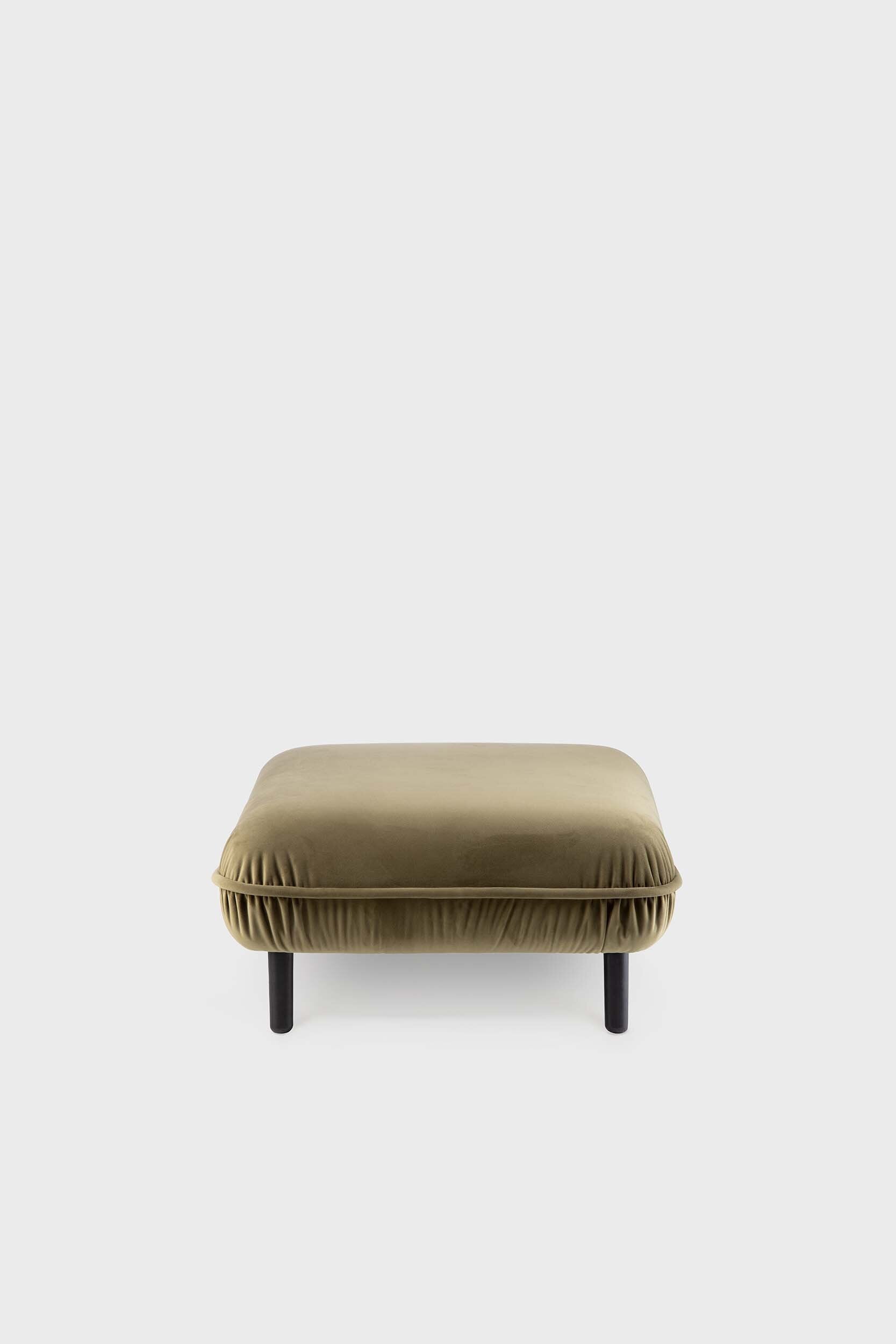 Bean Pouf featuring soft pleated velour fabric and elegant wooden legs, available in five colors.