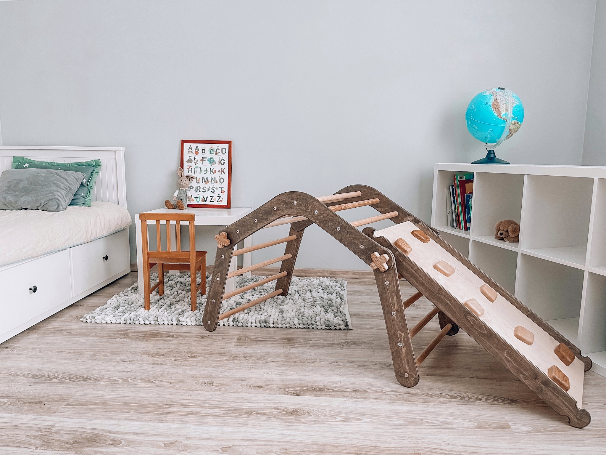Brown Panda Rock with Slide, a wooden climbing frame designed for children, featuring a slide and sturdy construction for safe play.