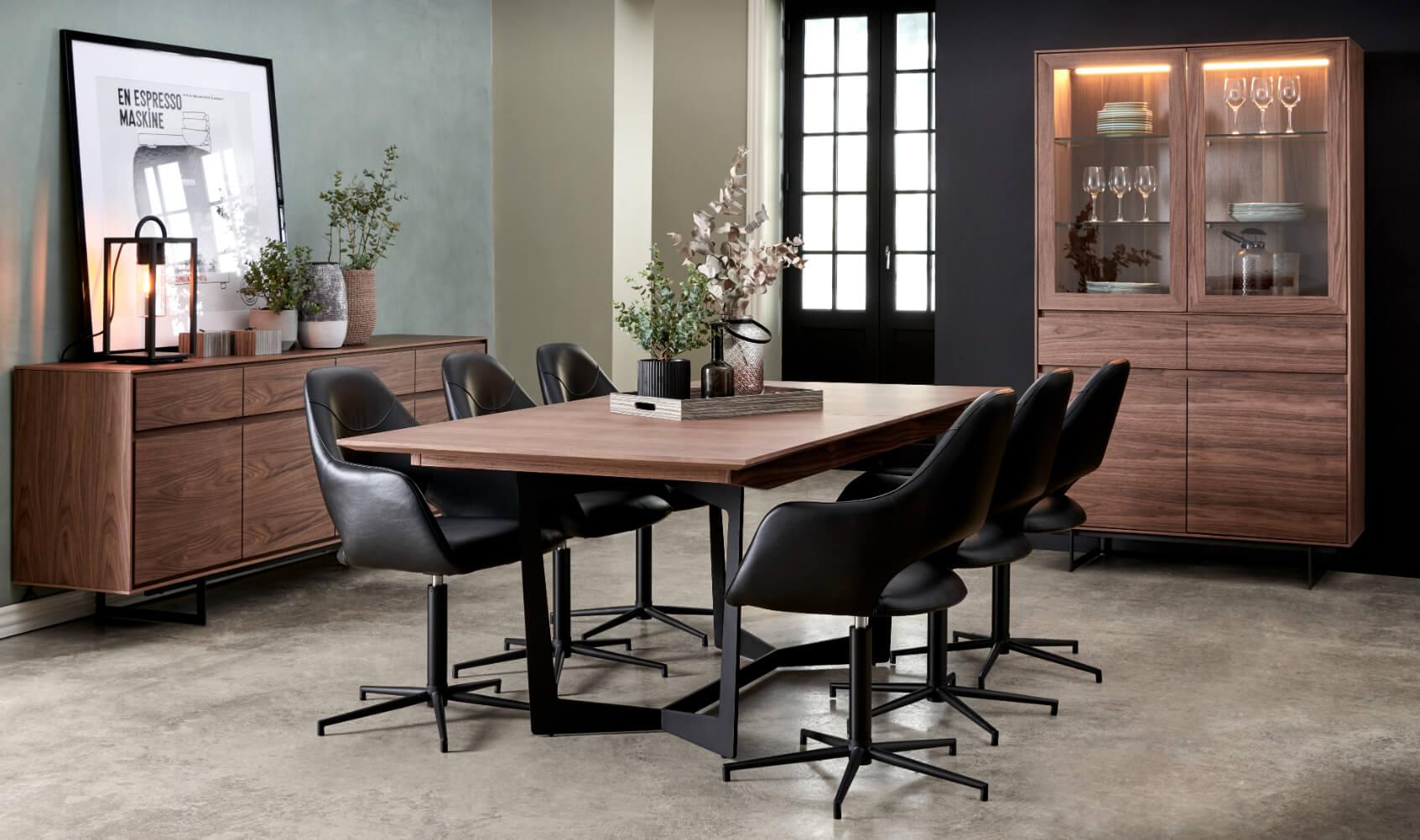 Extendable Walnut Dining Table Tokyo with butterfly extension, showcasing elegant design and sturdy steel base.