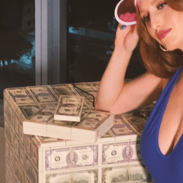 Levitating Stack 80s Series showcasing retro money stacks floating above a magnetic base, with a reflective vinyl wrap.