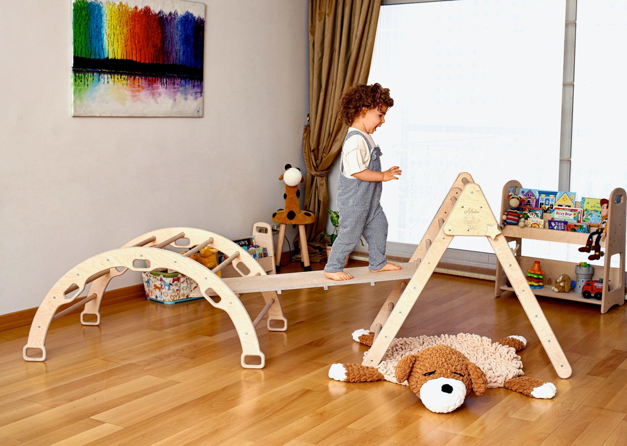 Montessori Climbing Set featuring a Pikler Triangle, Climbing Arch, and a 2-in-1 Ramp, made from natural wood, designed for children's play and development.