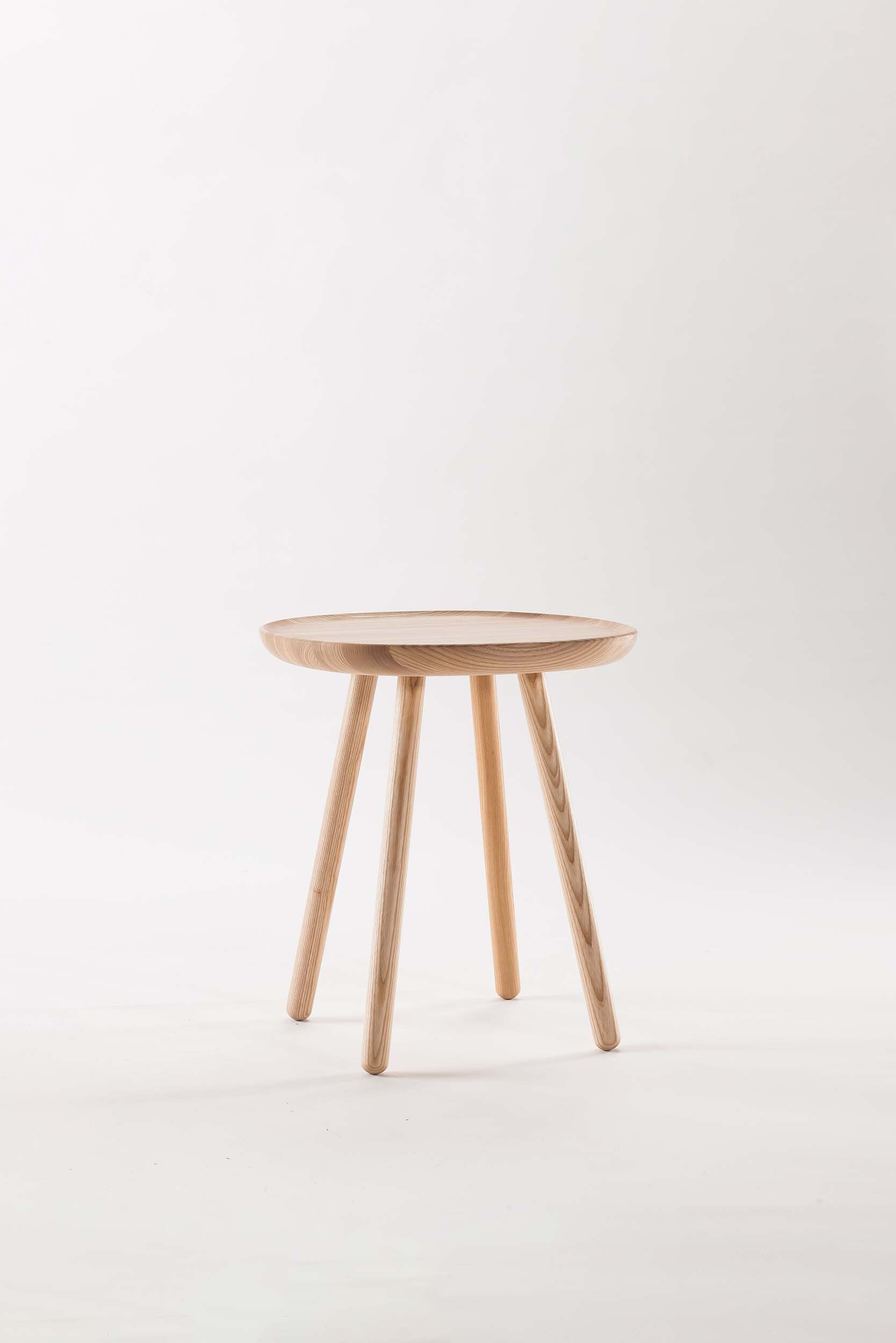 Naïve 61 Side Table in Natural Ash showcasing its unique shape and solid wood craftsmanship.