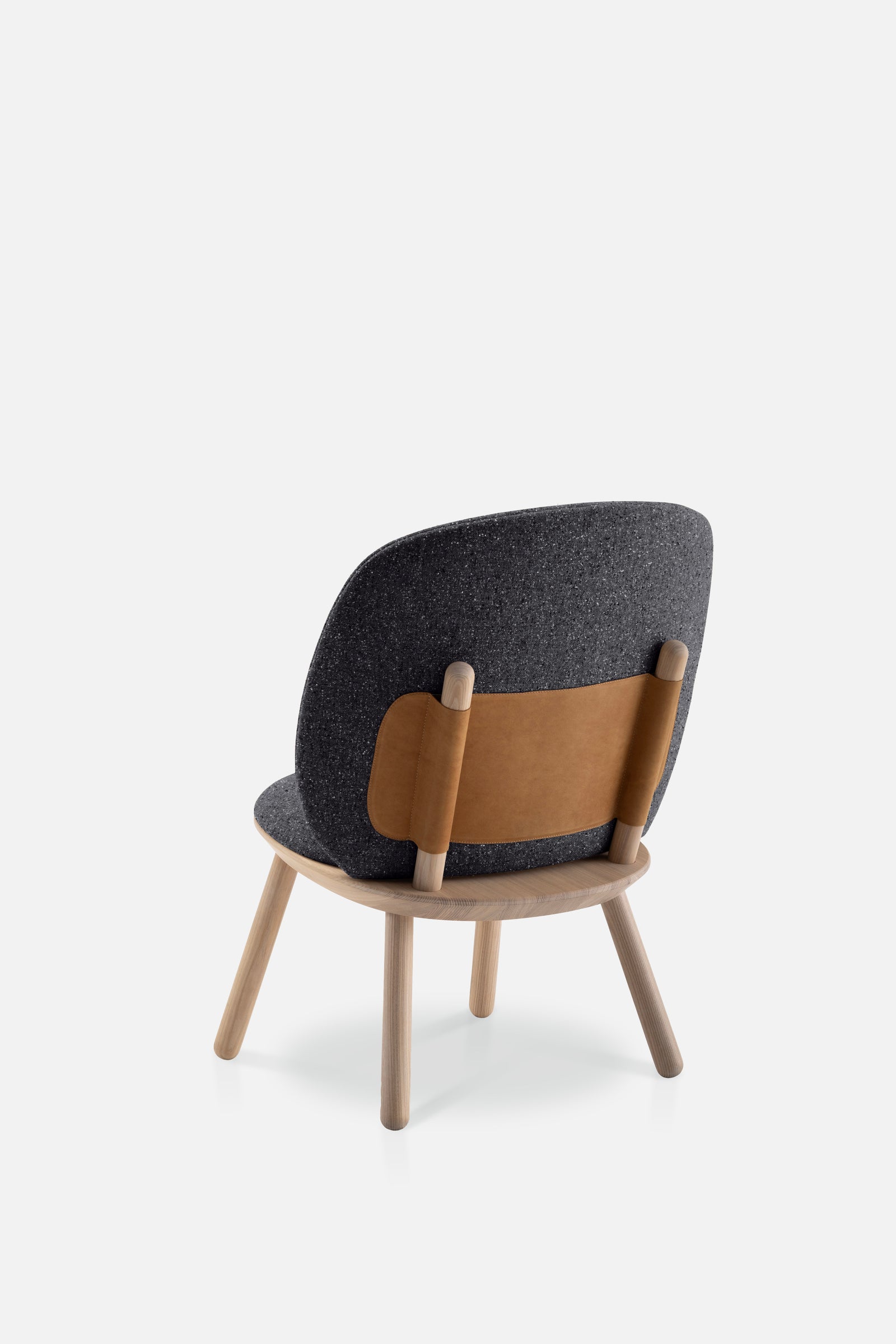 Naïve Low Chair in Black Solid Ash featuring a leather strap backrest, showcasing its elegant design and sturdy construction.