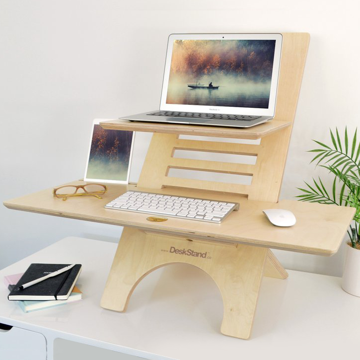Original DeskStand - Adjustable Standing Desk featuring a sleek design with a built-in cable manager and smartphone holder, made from premium Baltic Birch plywood.