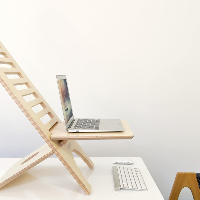 Original DeskStand - Adjustable Standing Desk featuring a sleek design with a built-in cable manager and smartphone holder, made from premium Baltic Birch plywood.