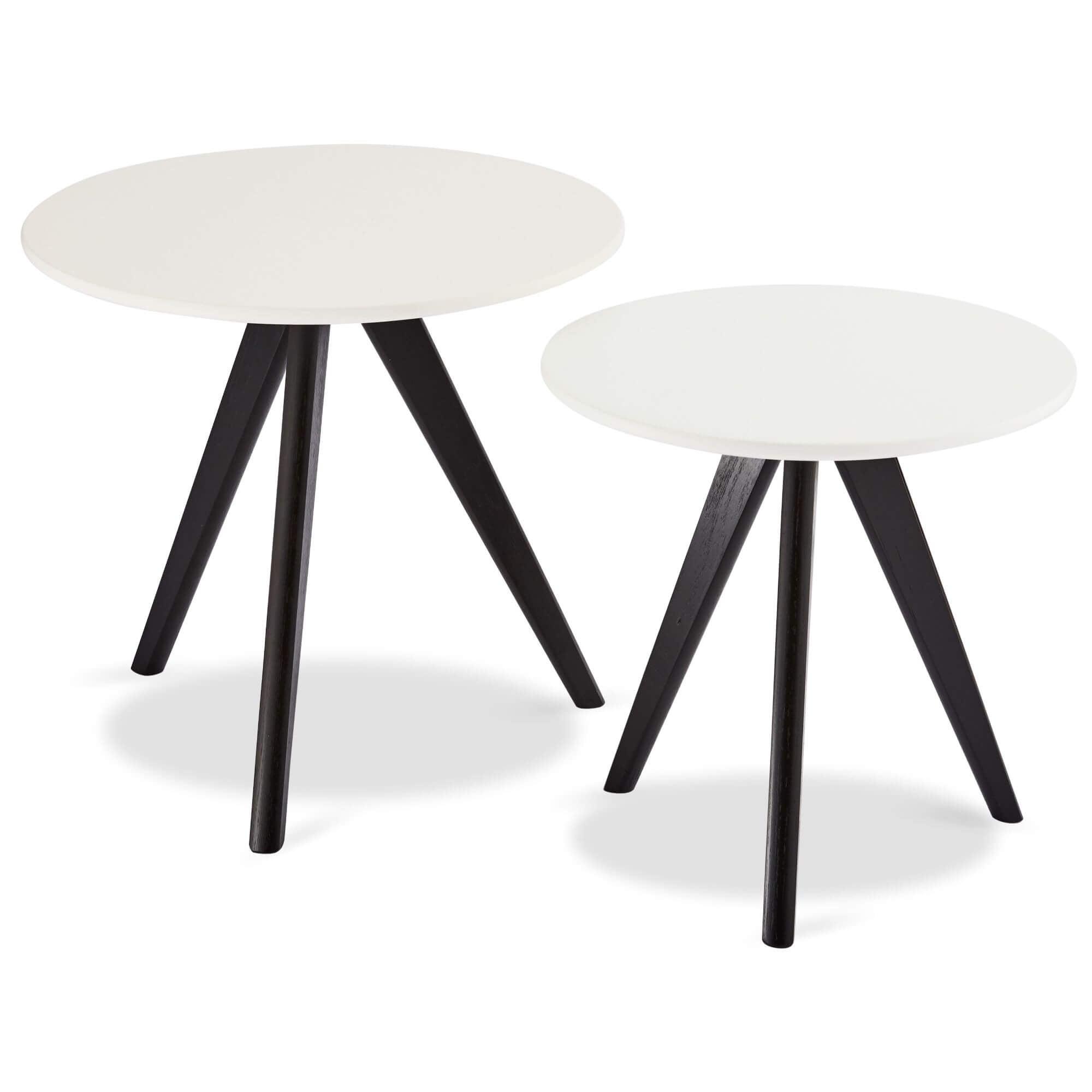 Round coffee table with white and black tabletop, featuring sturdy lacquered oak legs, designed for modern interiors.