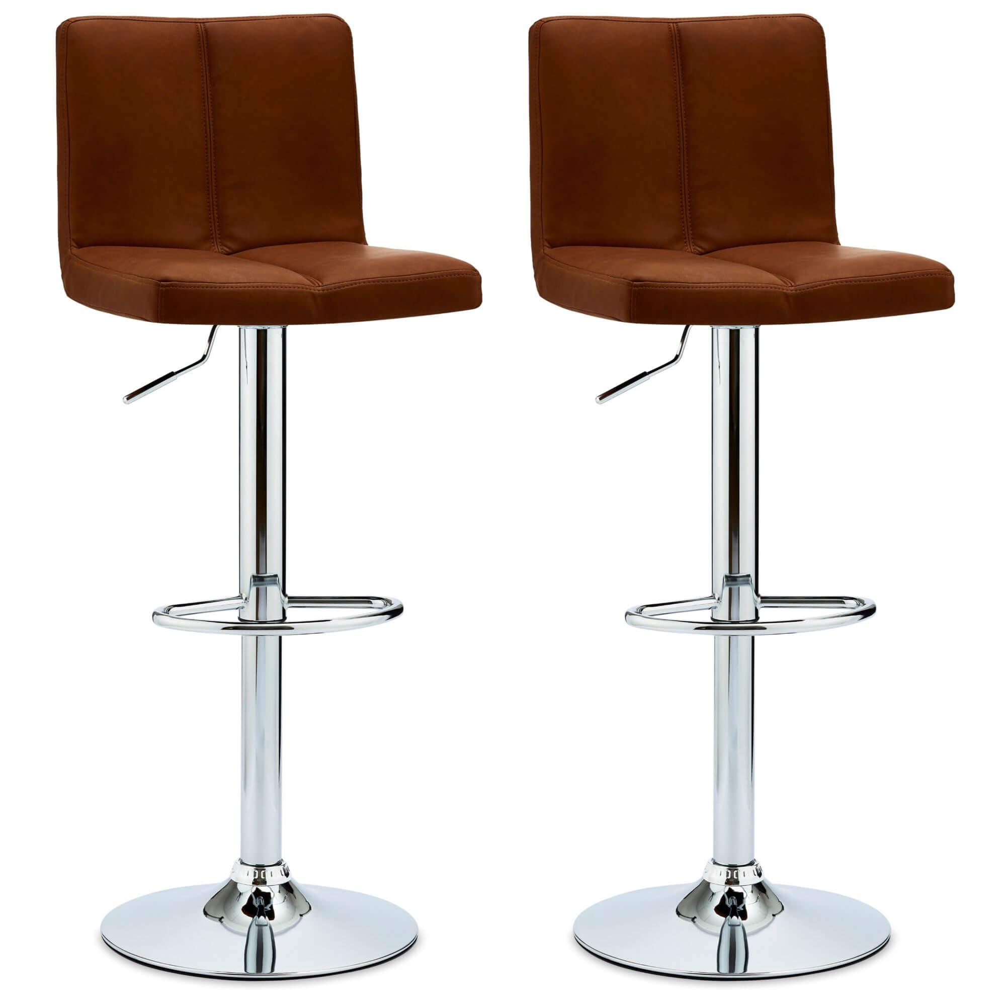 Set of 2 light brown Coco bar chairs with faux leather upholstery and adjustable metal bases, showcasing elegant design and decorative stitching.