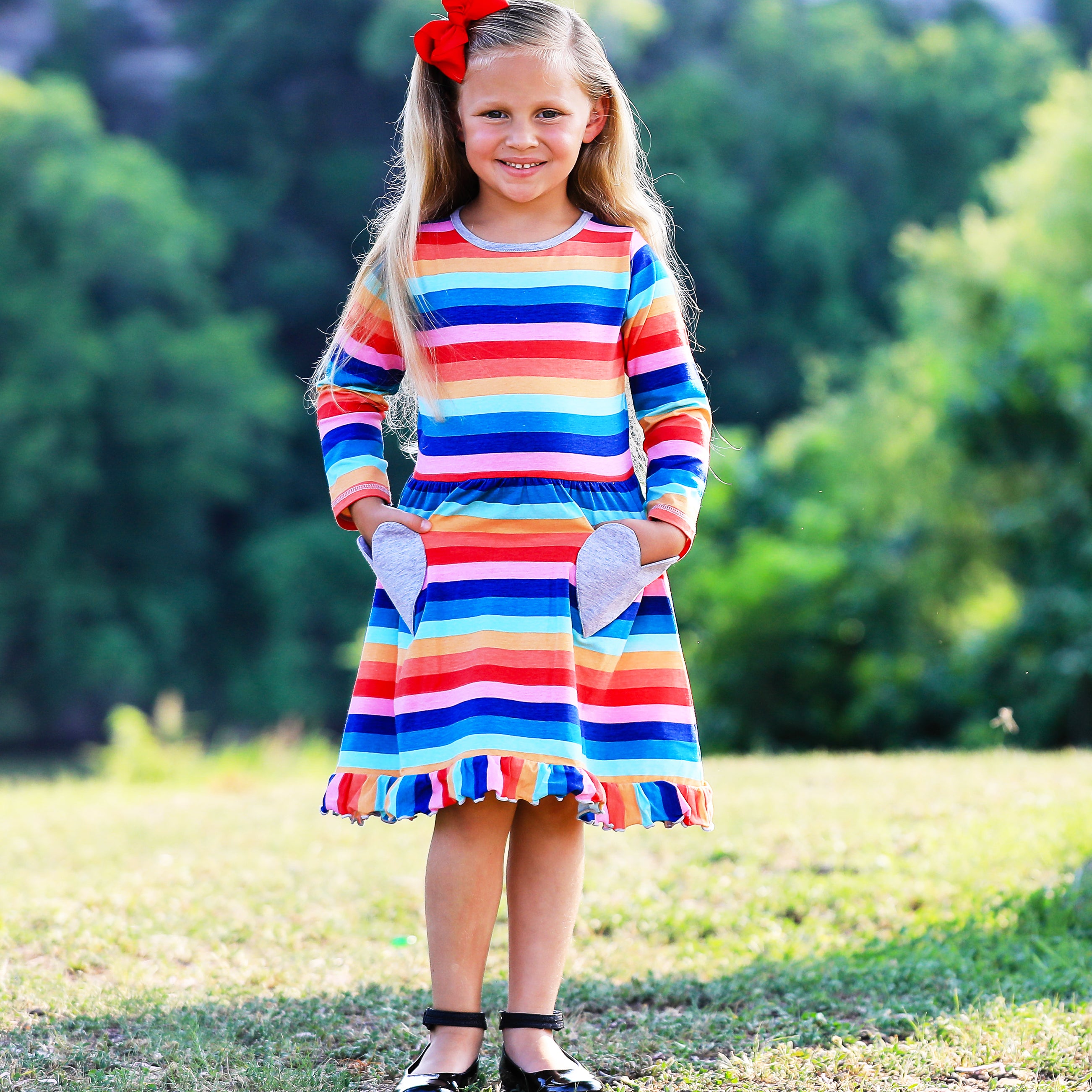 AnnLoren Baby Big Girls Boutique Fall Rainbow Hearts Cotton Winter dress featuring a vibrant rainbow print and silver heart appliques, perfect for autumn and winter.