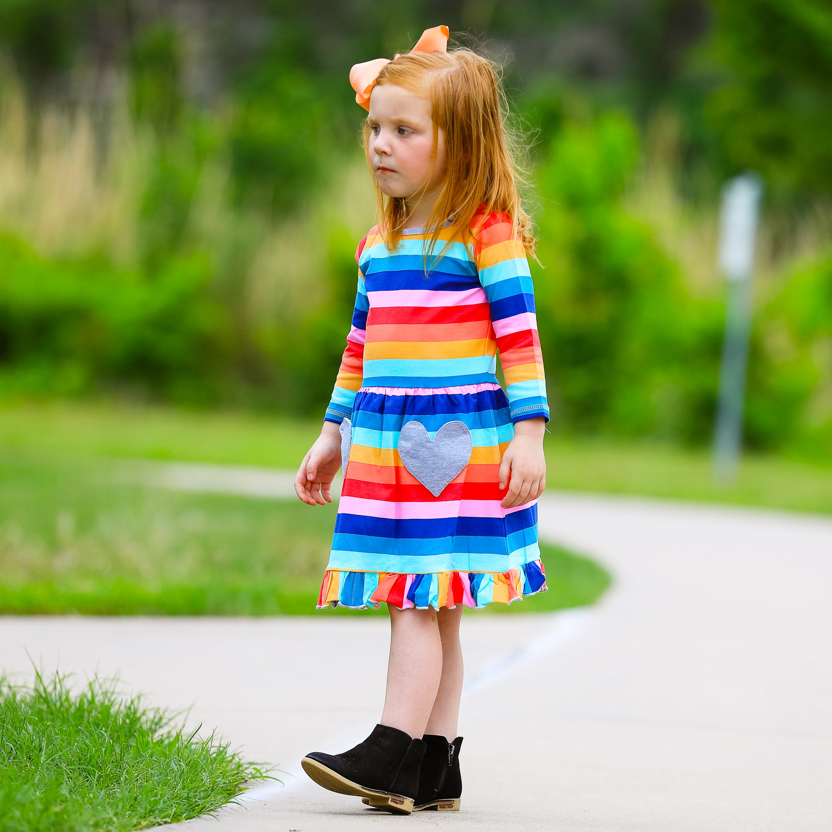 AnnLoren Baby Big Girls Boutique Fall Rainbow Hearts Cotton Winter dress featuring a vibrant rainbow print and silver heart appliques, perfect for autumn and winter.