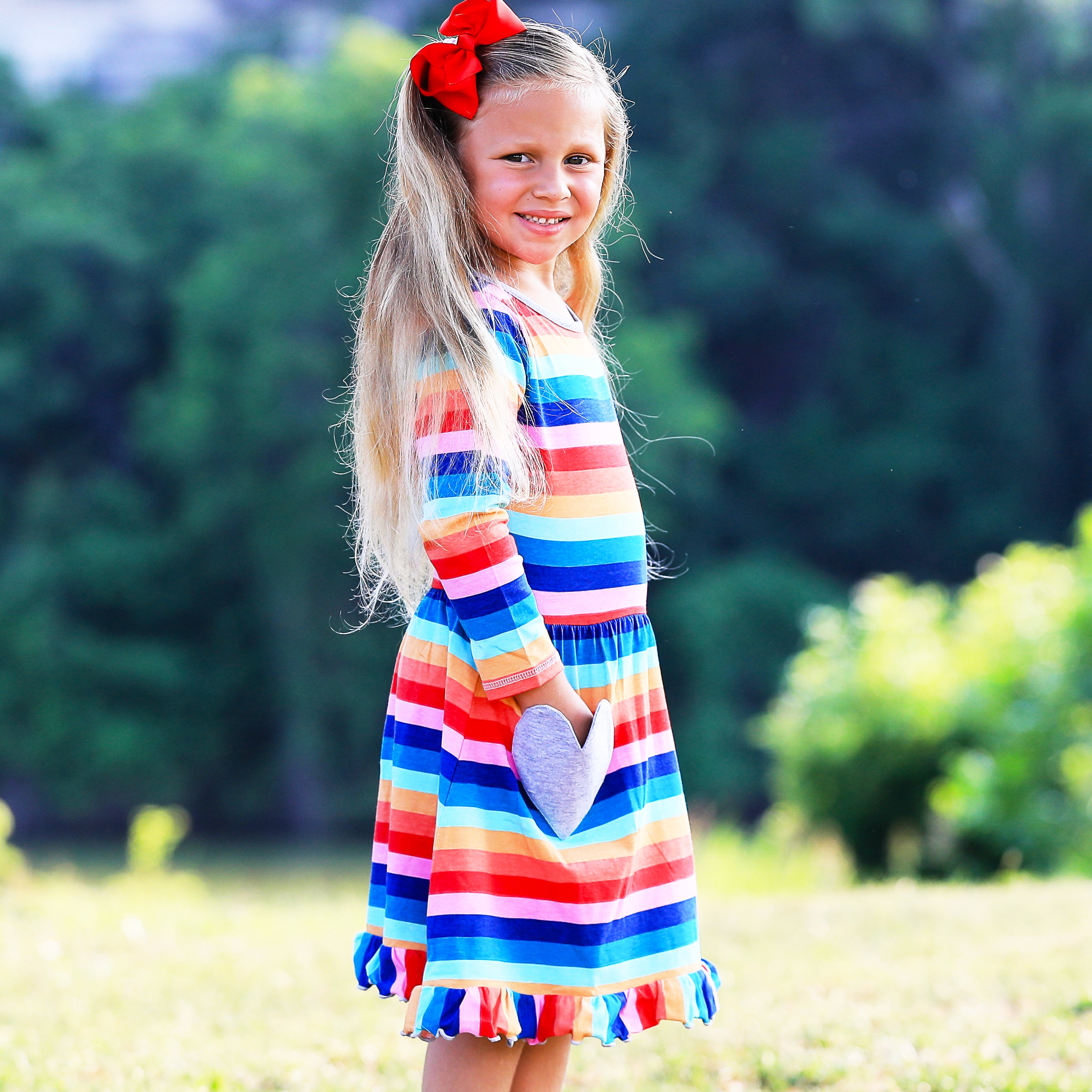 AnnLoren Baby Big Girls Boutique Fall Rainbow Hearts Cotton Winter dress featuring a vibrant rainbow print and silver heart appliques, perfect for autumn and winter.