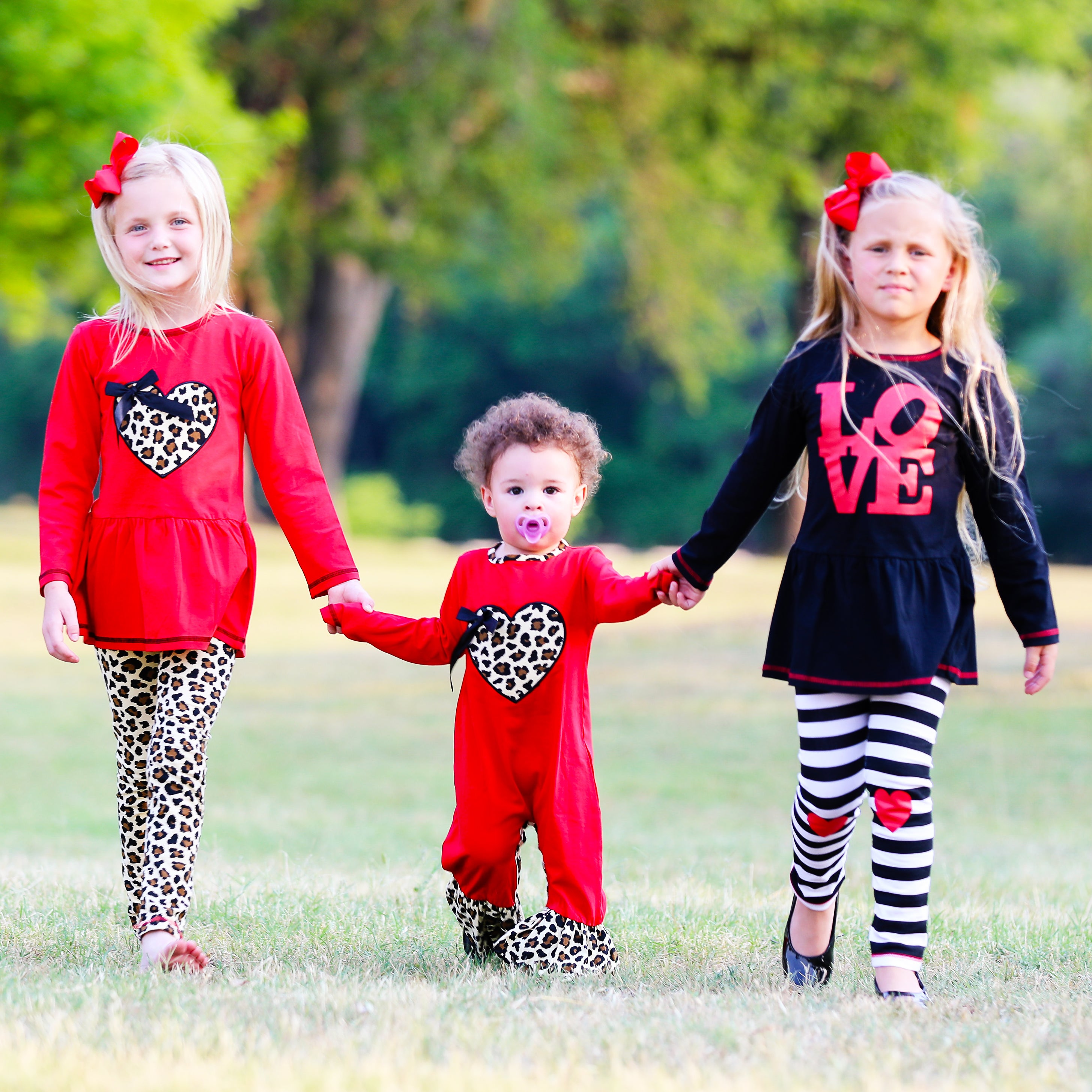 AnnLoren Baby Girls Leopard Valentines Romper featuring a leopard heart patch and ruffled legs, perfect for holiday celebrations.