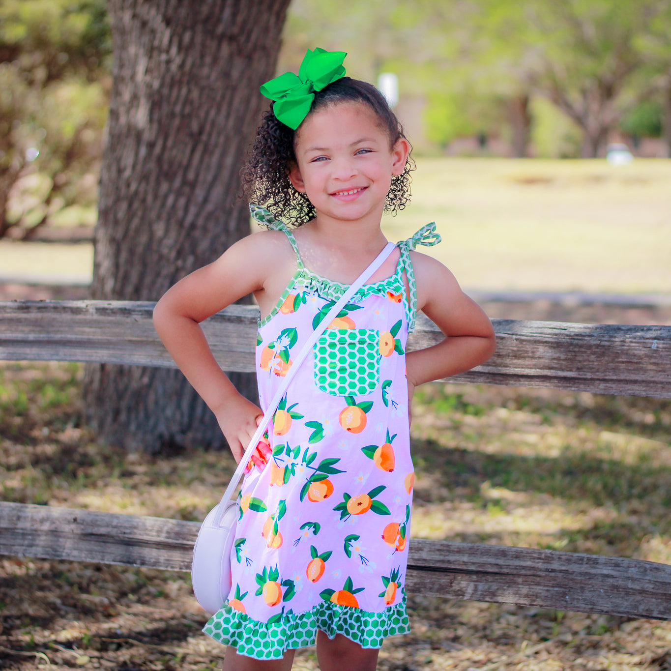 AnnLoren Big Little Girls Pretty as a Peach Pink Spaghetti Strap Dress featuring green polka dot ruffles and a chest pocket.