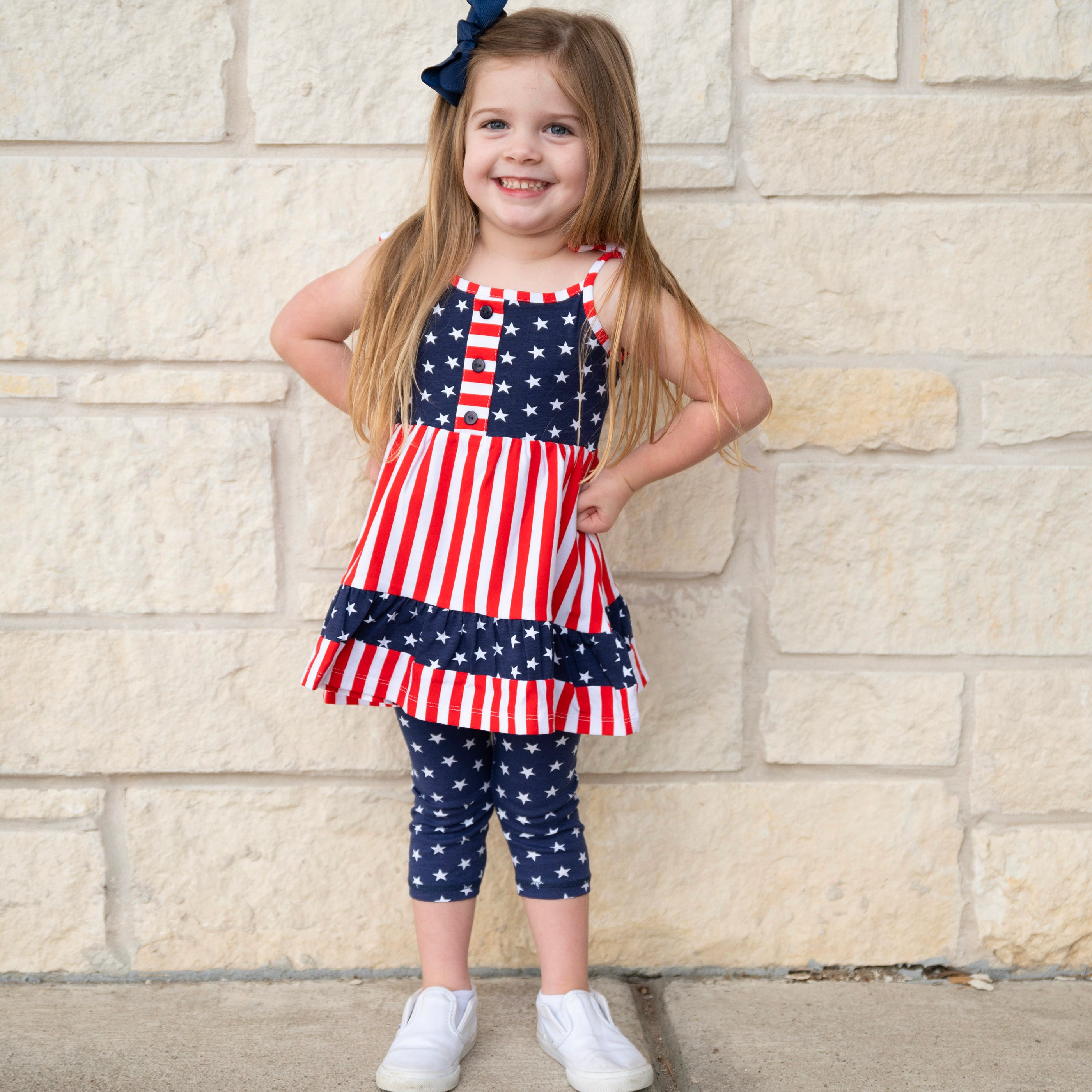 AnnLoren Girls 4th of July dress featuring red and white stripes with blue stars, paired with blue star capri leggings.