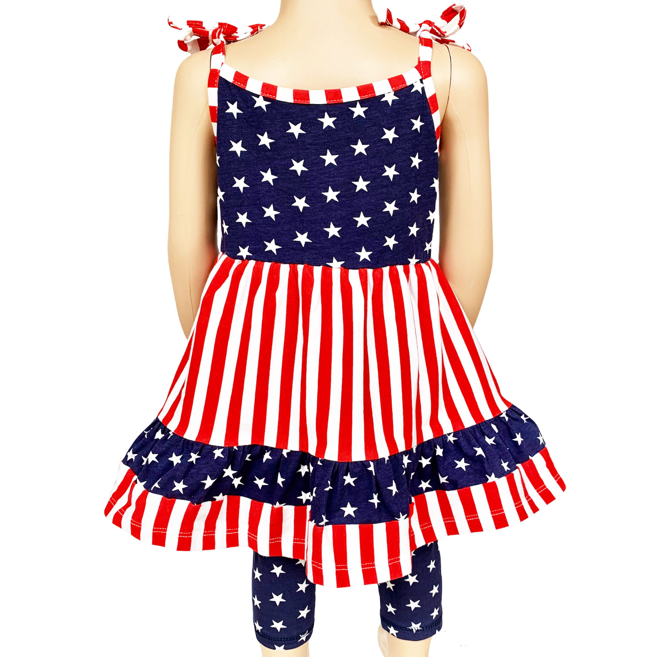 AnnLoren Girls 4th of July dress featuring red and white stripes with blue stars, paired with blue star capri leggings.
