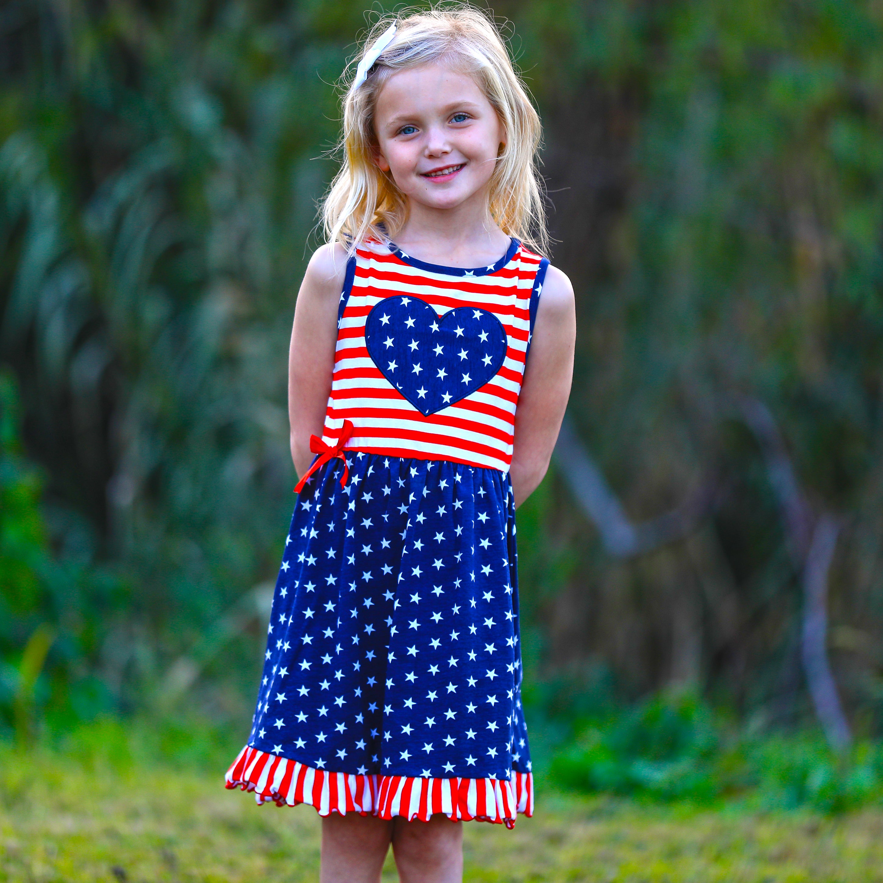 AnnLoren Girls 4th of July Stars & Striped Heart Dress featuring red and white stripes with a blue star patch, perfect for summer celebrations.