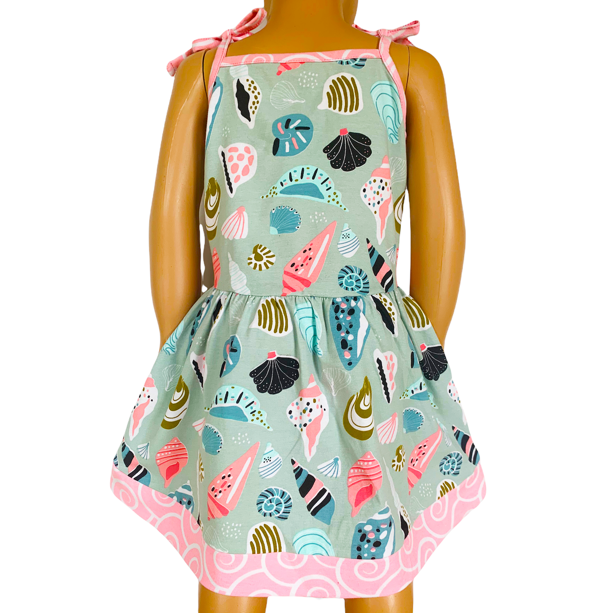 AnnLoren Little & Big Girls Seashells Dress featuring spaghetti straps and pink swirl trim, made from soft cotton knit fabric.