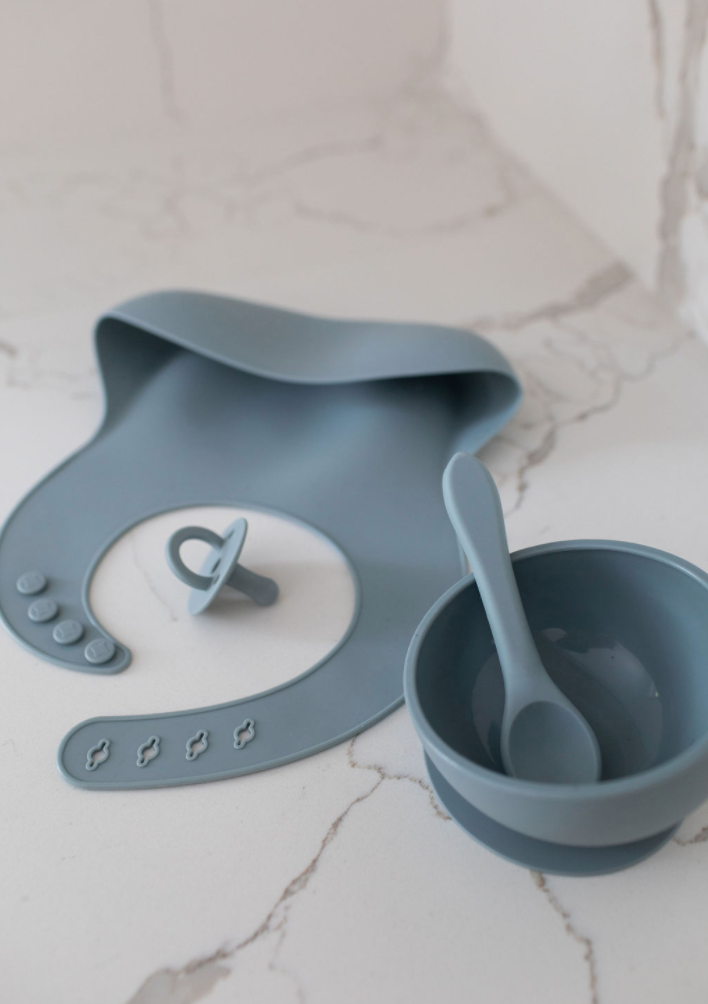 Azul Silicone Bib Set featuring adjustable design, gender-neutral colors, and a deep pocket for catching spills, perfect for kids aged 18 months to 8 years.