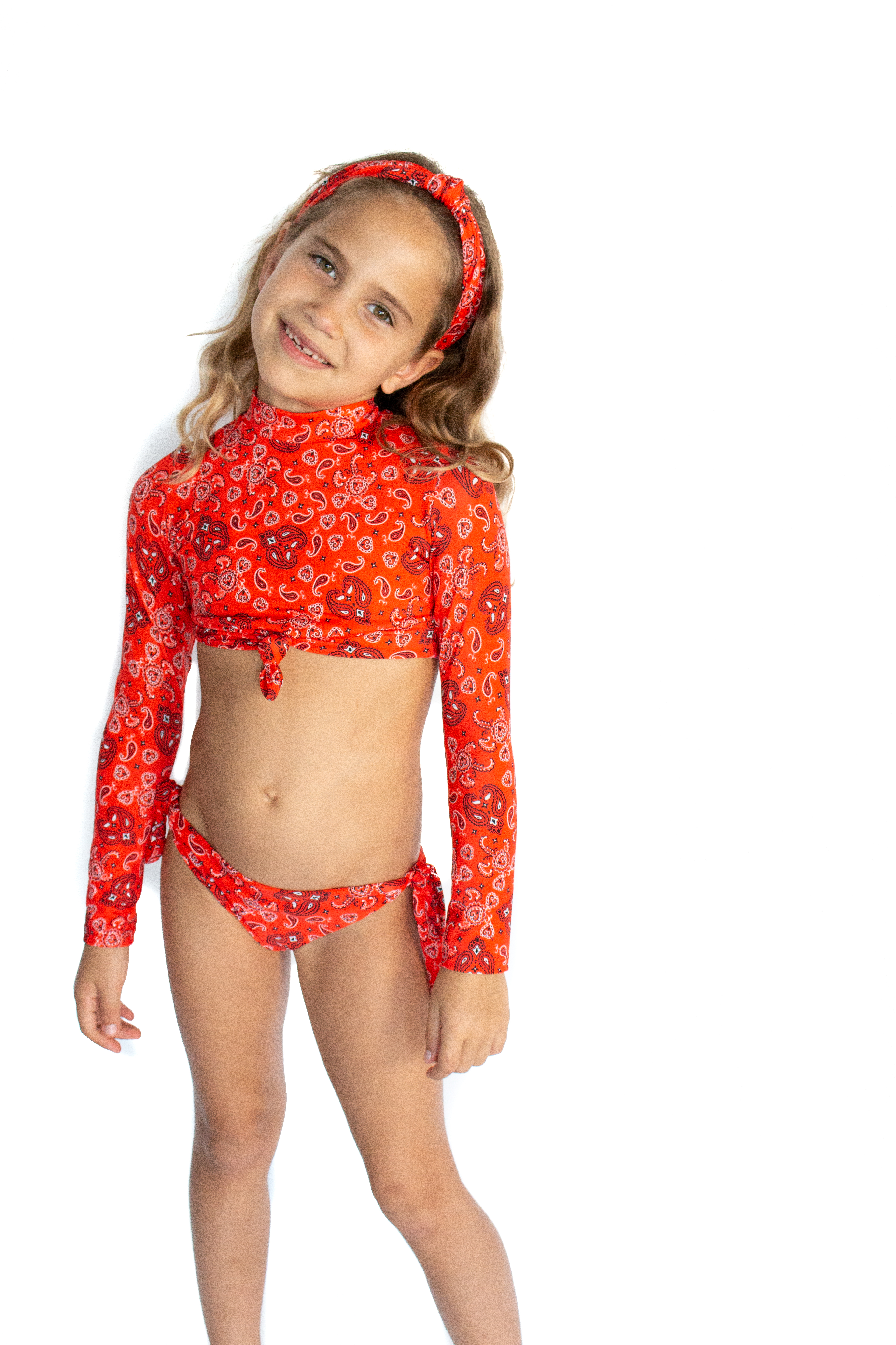 A stylish bandana print bikini crop top swimsuit made from printed Lycra, featuring UPF 50+ sun protection.
