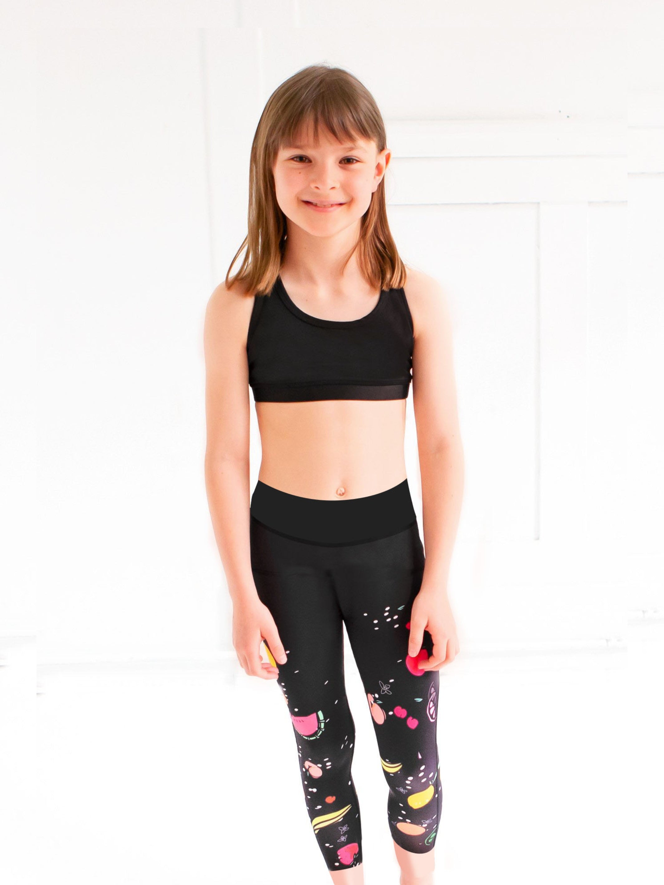 Girls Activewear Capri Leggings in vibrant fruit print, designed for comfort and mobility.