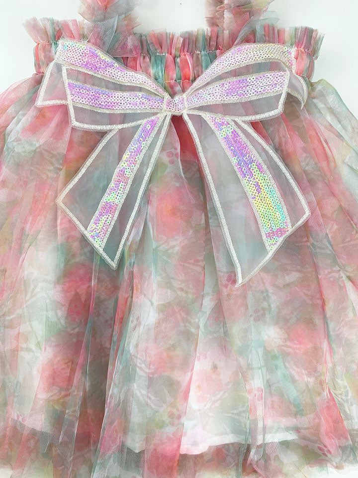 A charming pink floral tulle dress featuring a big sequined bow at the front, perfect for summer parties.