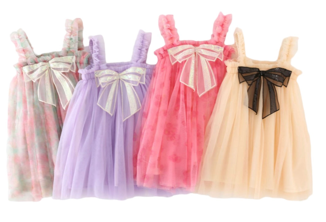 A charming pink floral tulle dress featuring a big sequined bow at the front, perfect for summer parties.