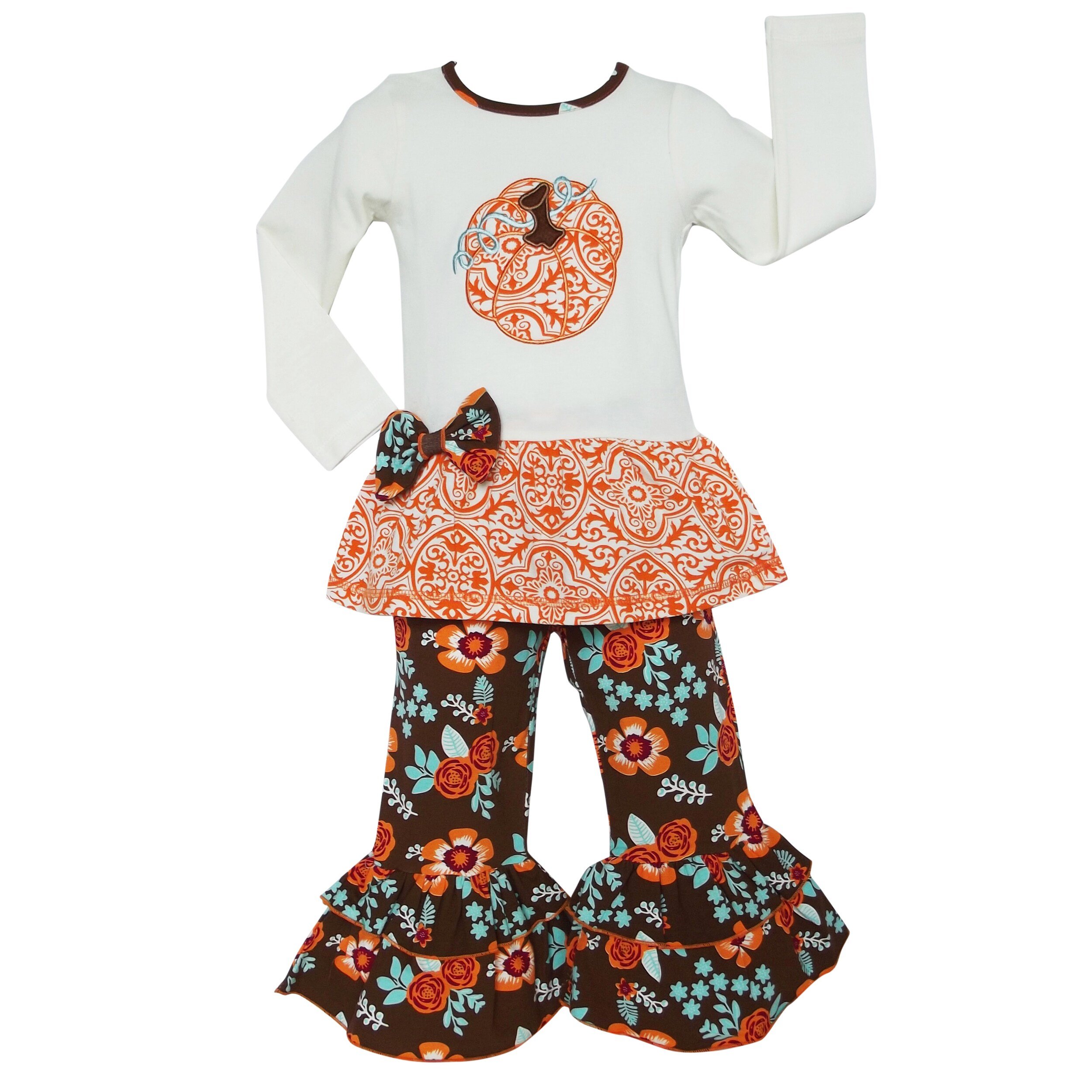 Big Girls Autumn Tunic Set featuring a cream long sleeve shirt with orange pumpkin embroidery and floral pants with ruffles.