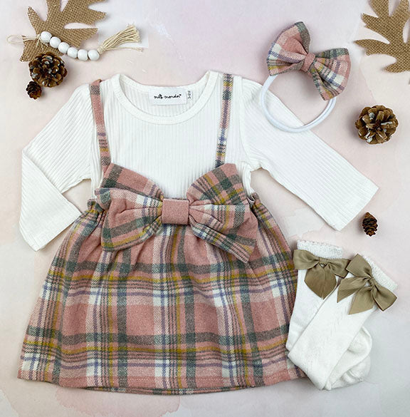 A cozy pink flannel 2 pc dress set for babies, featuring a big front bow and matching headband, perfect for winter wear.