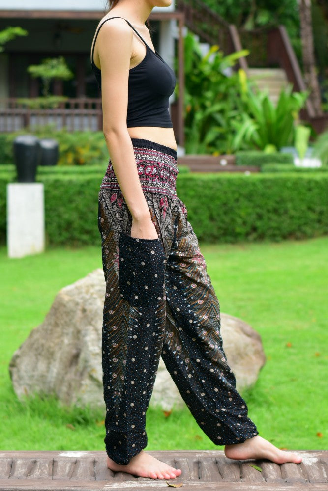 Bohotusk Kids Black & Gold Peacock Harem Pants featuring elasticated waist and ankles, made from soft rayon fabric.